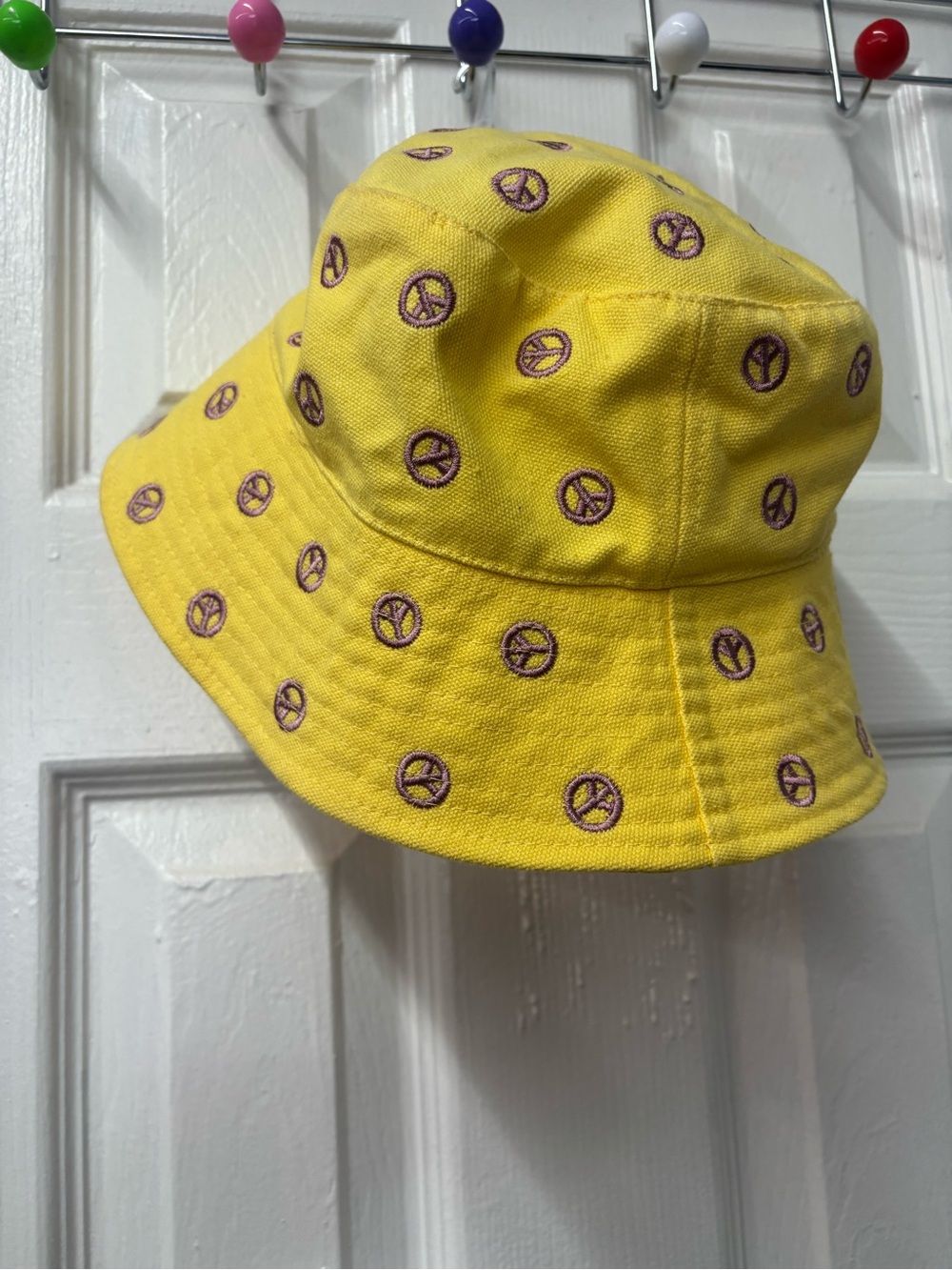 Urban Outfitters Yellow Bucket Hat with Purple Peace Sign Embroidery